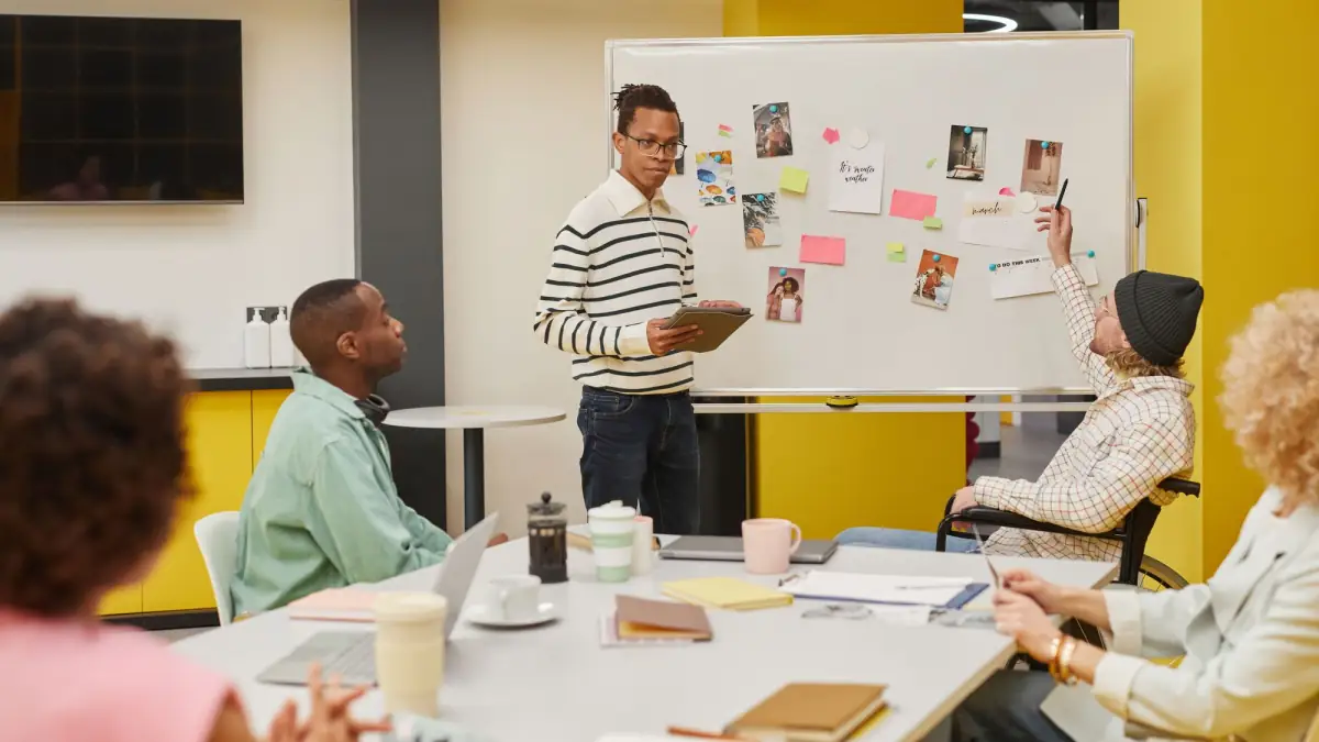 Team gathered around a whiteboard during a planning session